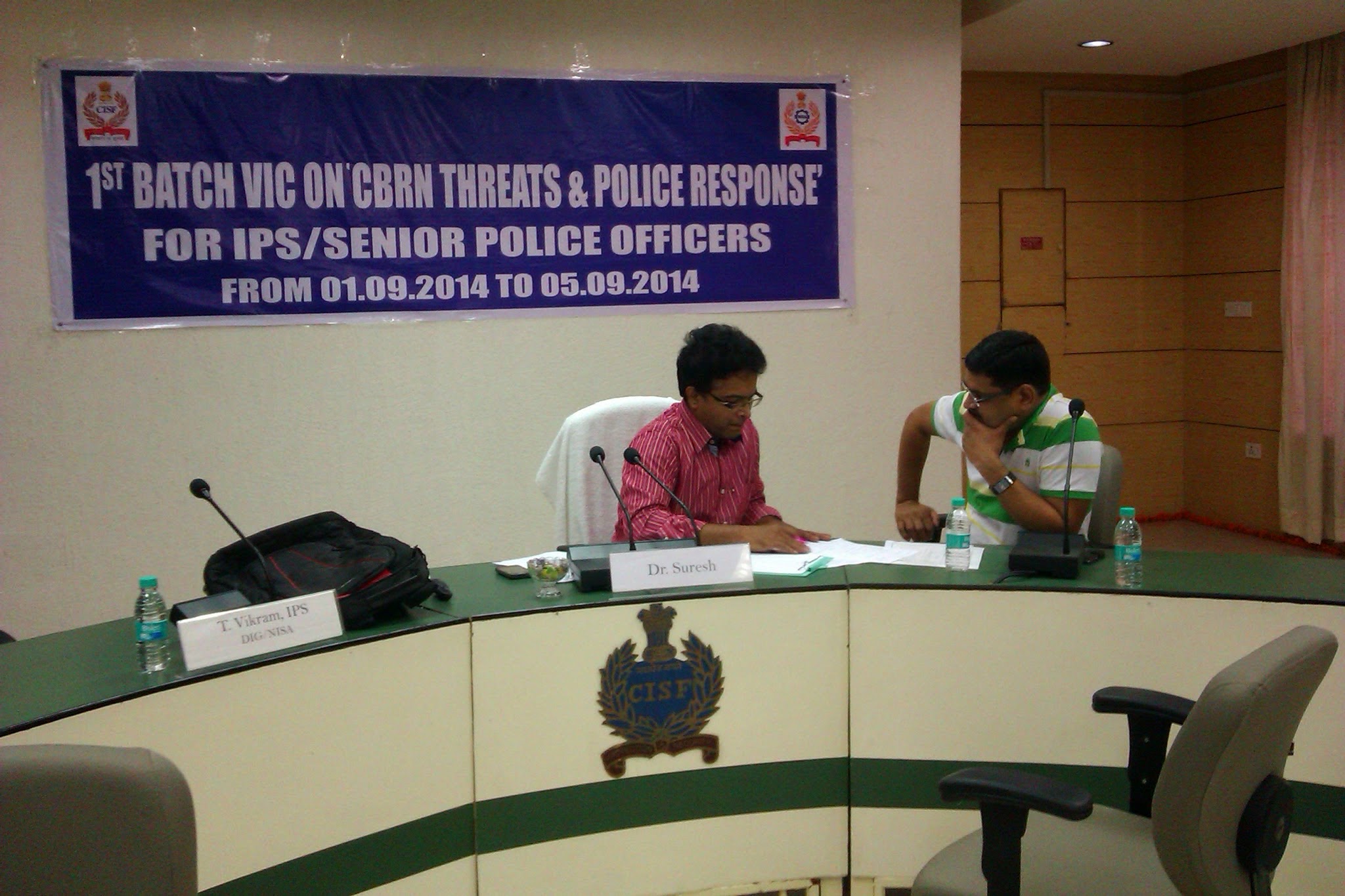 Dr. Suresh Kumar seated alongside DIG T. Vikram, IPS at the CISF National Industrial Security Academy workshop for IPS and Senior Police Officers