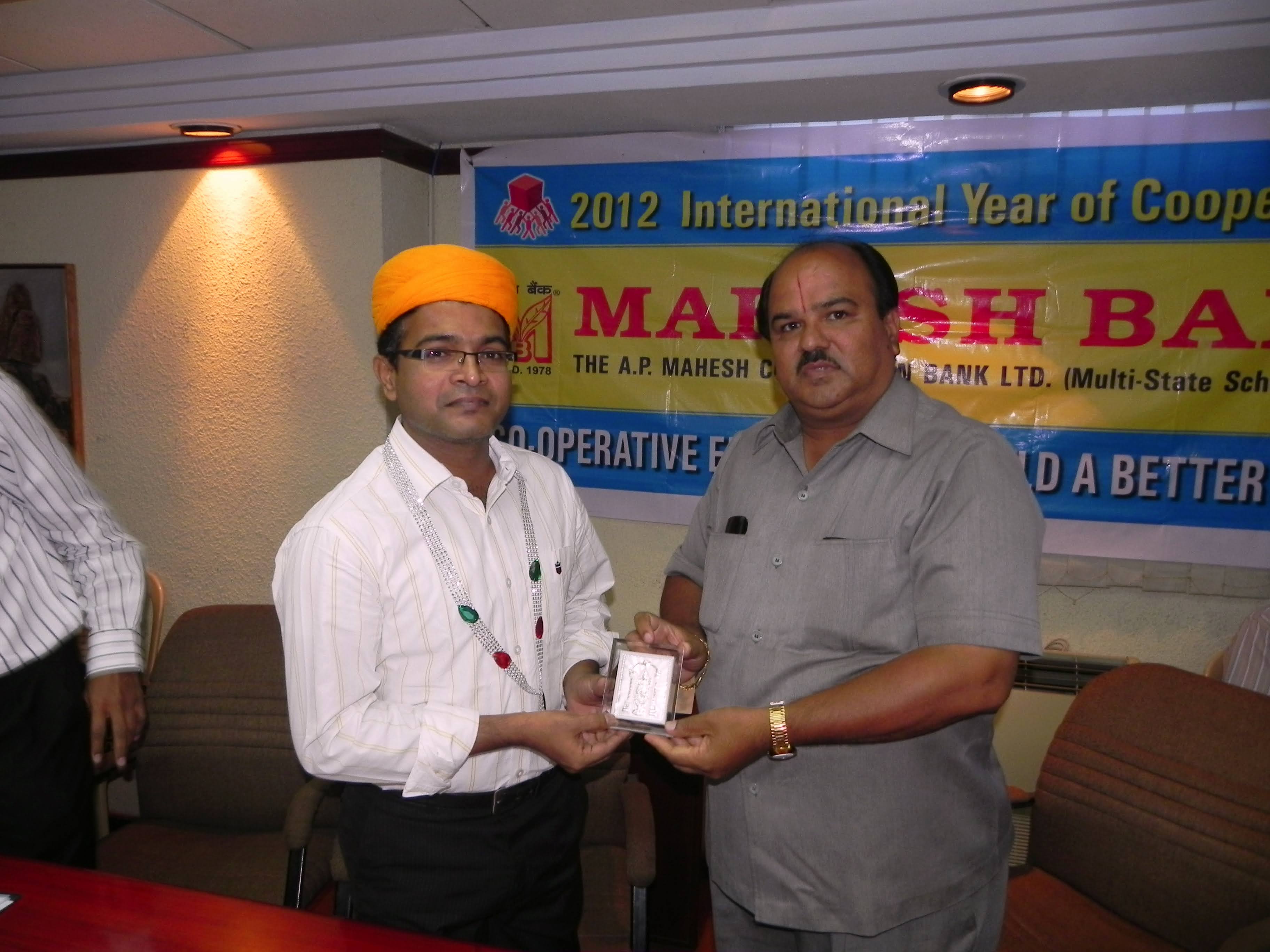 Dr. Suresh Kumar being felicitated by the leadership of The A.P. Mahesh Co-operative Urban Bank Ltd. in 2012