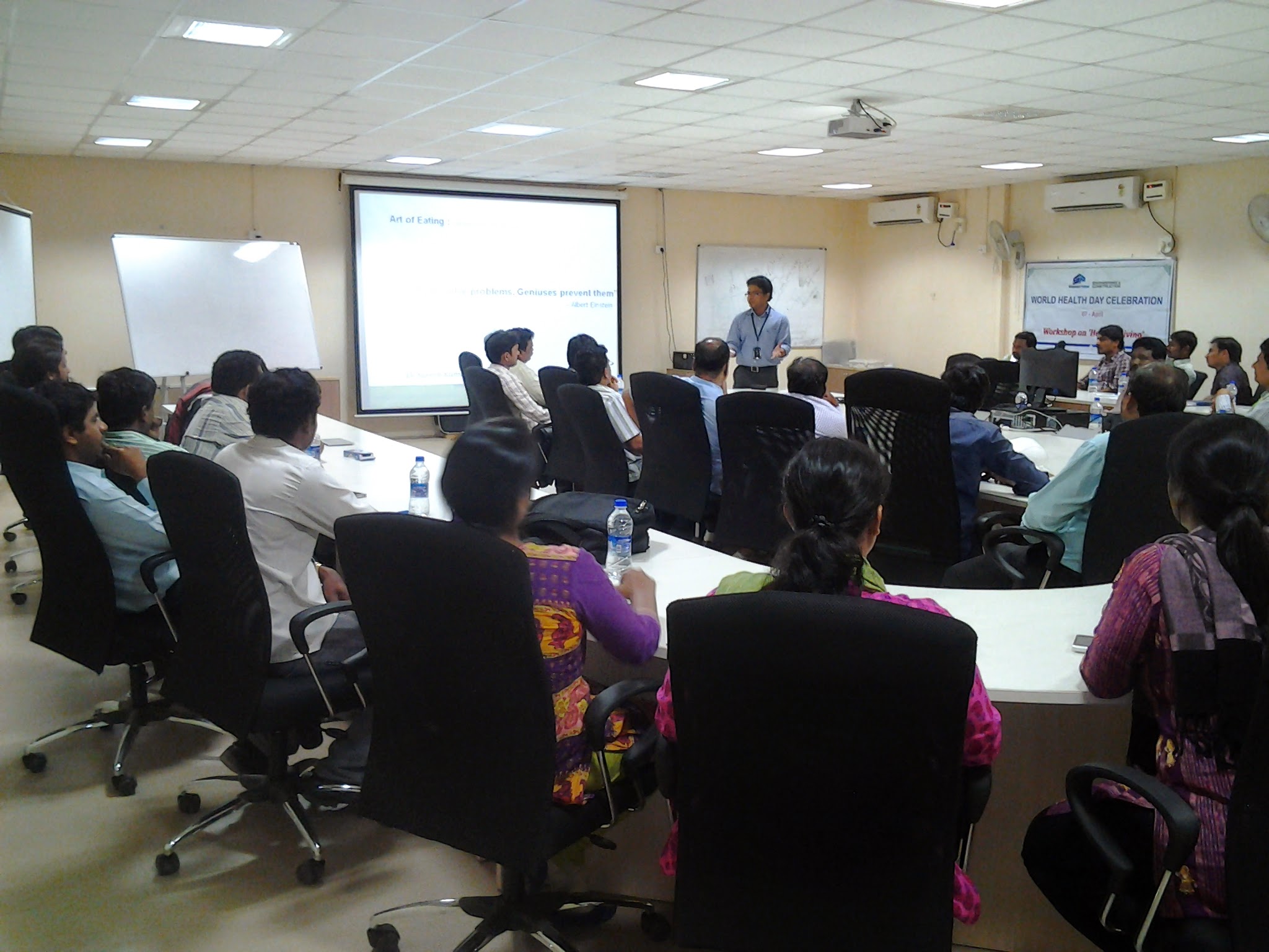 Dr. Suresh Kumar leading the World Health Day Healthy Living workshop in the Shapoorji Pallonji Engineering & Construction boardroom